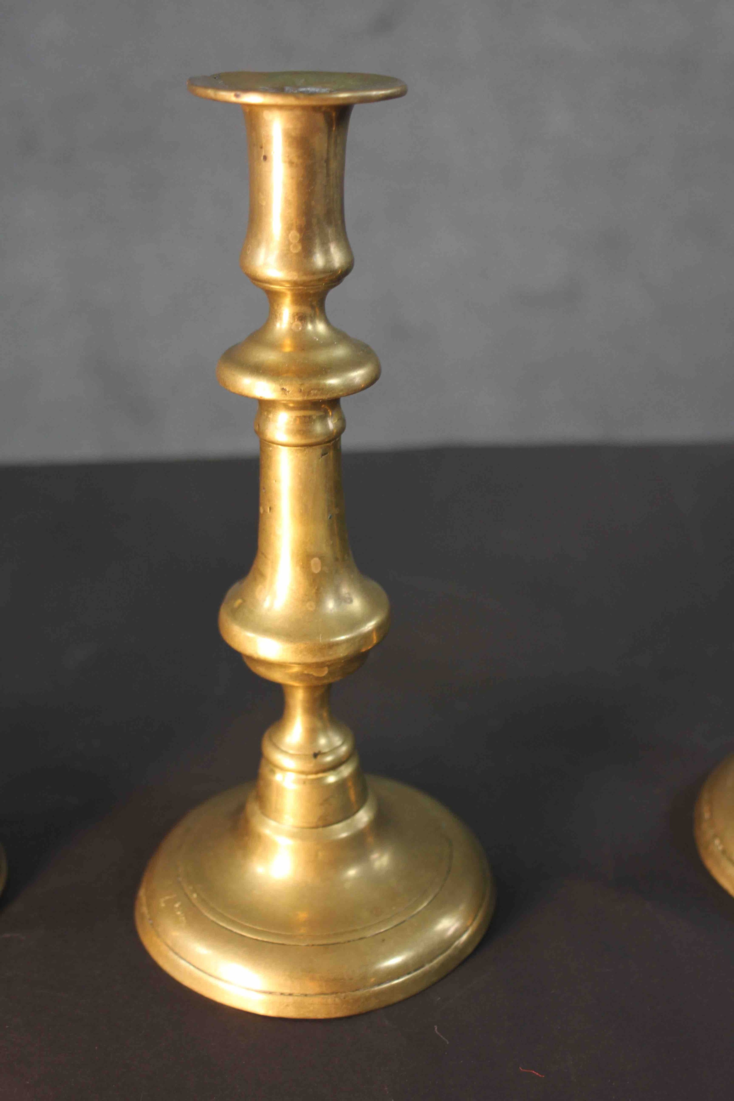 A pair of early 20th century brass candlesticks along with a portable brass candlestick lantern with - Image 5 of 8