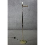 A vintage brass extending standard lamp with hinged articulated arm. H.152 (fully extended) W.28cm.