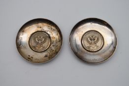 A pair of Britania standard, silver London 1972 coin dishes, with a double headed eagle, engraved in