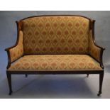 A late 19th century mahogany Art Nouveau salon settee inlaid with stylised foliate panels and in