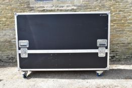 A very large flight case on wheels with brakes fitted. To take a 65" TV kit. H.110 W.169 D.53cm