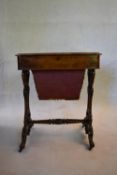 A mid Victorian burr walnut sewing table with floral inlay to the inside of the hinged lid and