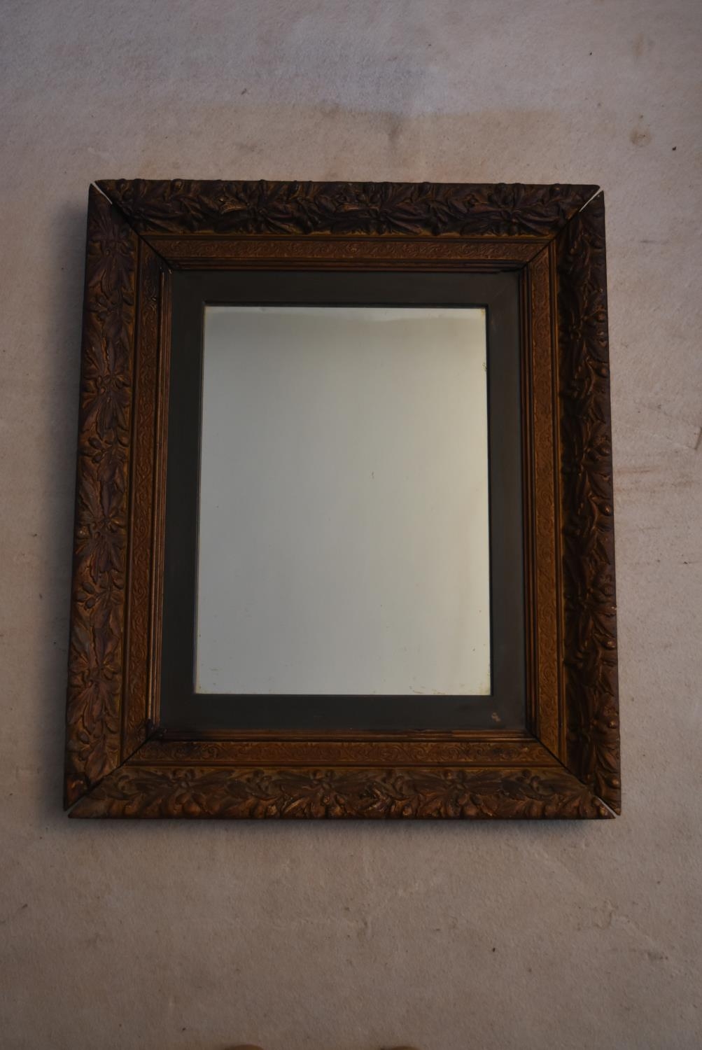 A 19th century giltwood and gesso decorated wall mirror. H.75 W.62cm