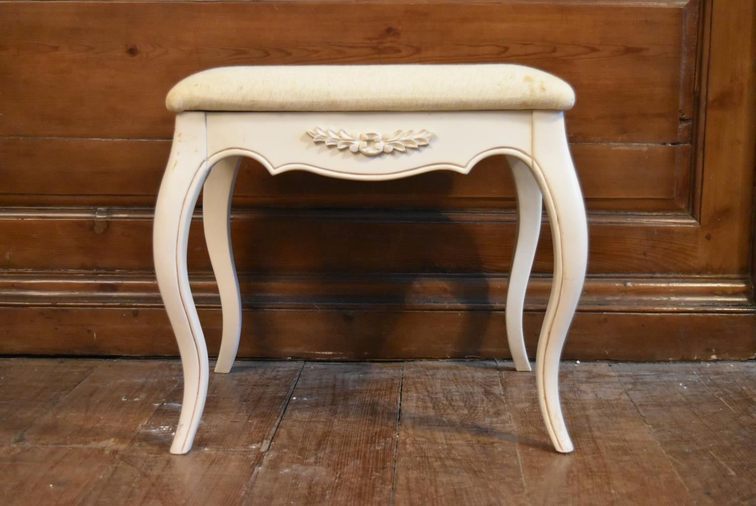 A Louis XV style white painted stool on slender cabriole supports. H.47 W.47 D.36cm