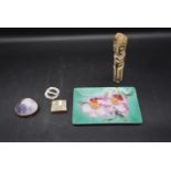 A carved bone figure, an enamelled tray, along with mother of pearl items and a shell box. H.12 W.
