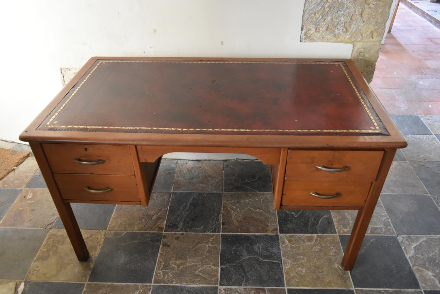 A vintage teak desk with inset gilt tooled leather top on square legs. H.74 W.135 D.75cm - Image 2 of 7