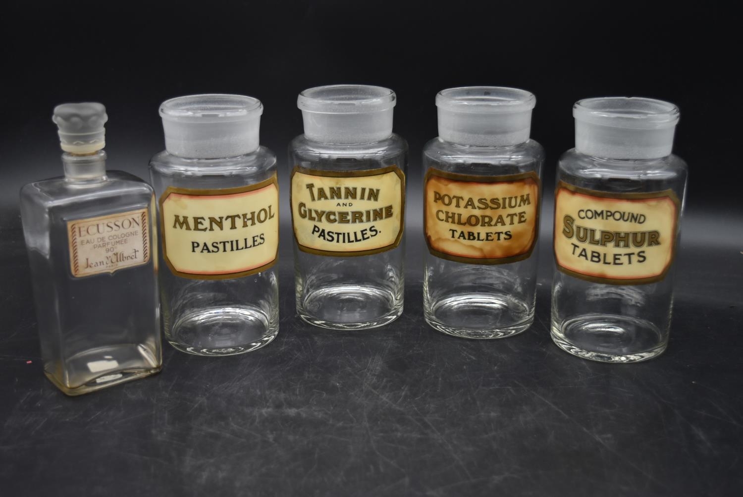 A matching set of four pharmacy jars with stoppers along with a vintage French perfume bottle. H.
