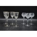 A set of four 20th century baluster cut crystal wine glasses, with gilded detail on the lip and