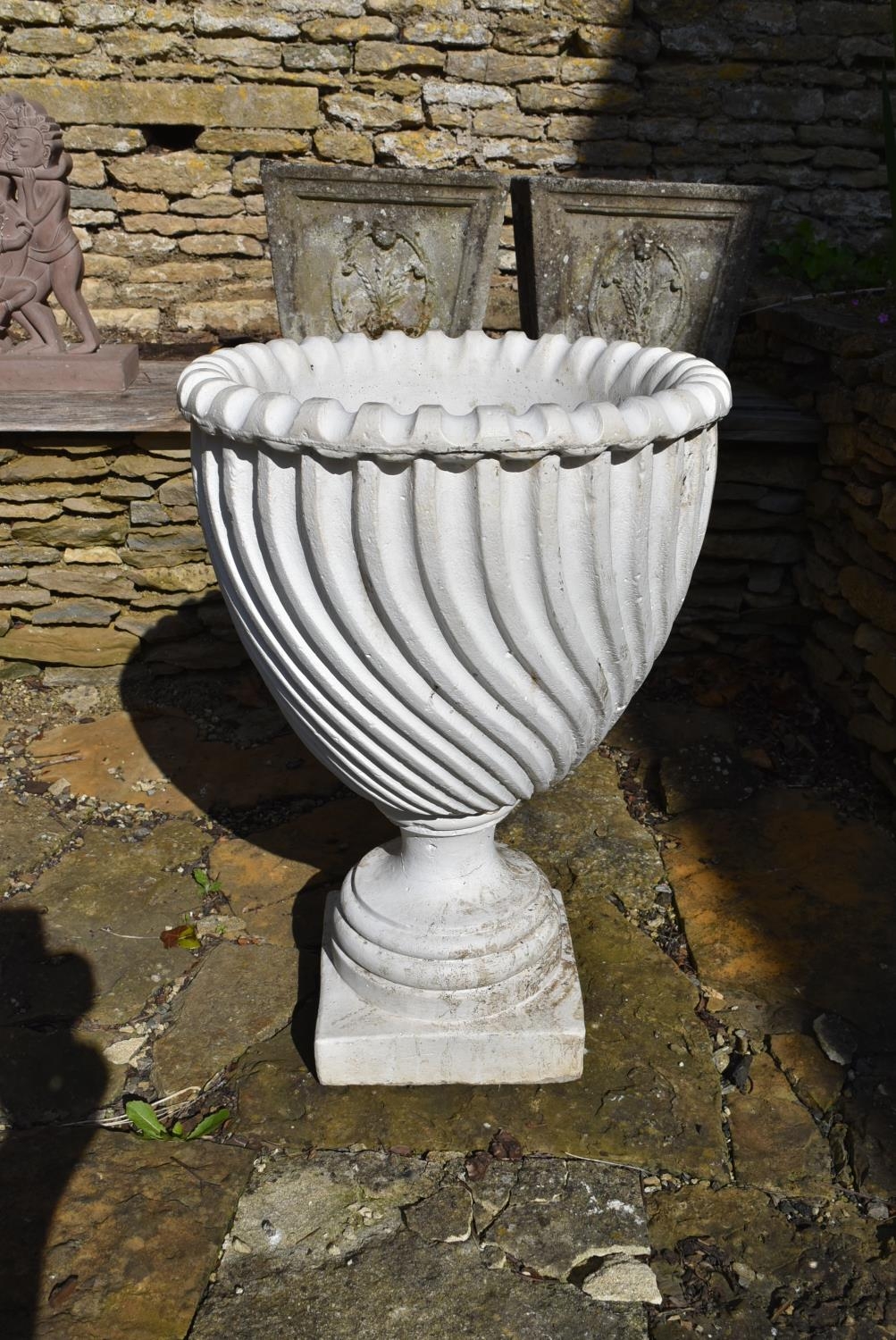 A painted reconstituted stone garden urn with spiral decoration on stepped base. H.68 Dia.46cm - Image 2 of 4