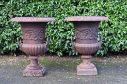 A pair of cast iron campana form garden urns with twin lion's mask handles. H.50 Dia38cm (2)