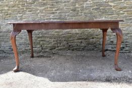 A mid century burr walnut Epstein dining table with extra leaf on carved cabriole supports. H.75 W.