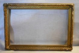 A large 19th century giltwood and gesso decorated picture frame. H.110 W.157cm