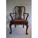 An early 20th century Georgian style mahogany armchair with vase shaped splat on cabriole pad foot