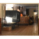 A large wall mirror in bevelled and glazed frame. H.142 W.170cm (some damage as photographed)