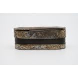 A engraved white metal and leather tin lined snuff box. An engraved shield shape cartouche and