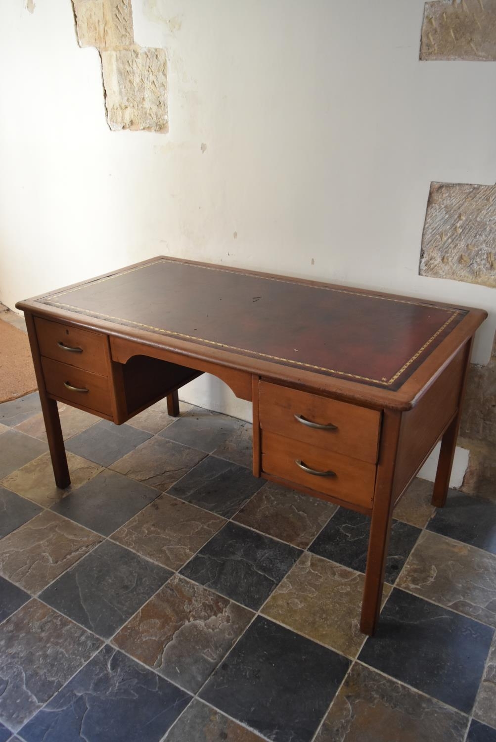 A vintage teak desk with inset gilt tooled leather top on square legs. H.74 W.135 D.75cm - Image 3 of 7