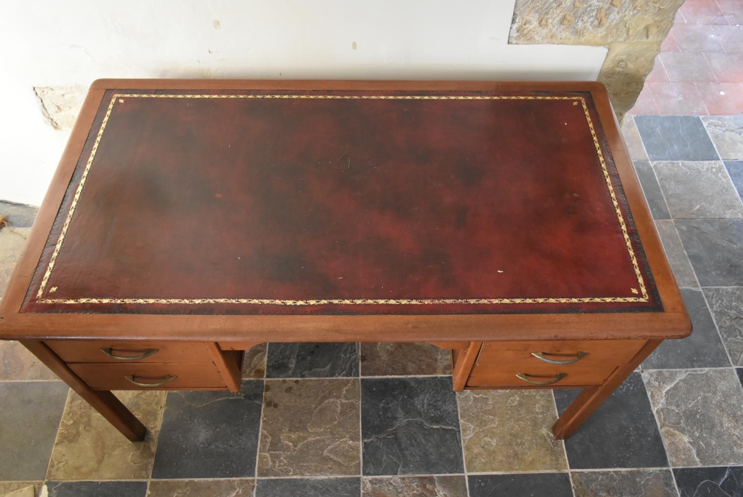 A vintage teak desk with inset gilt tooled leather top on square legs. H.74 W.135 D.75cm - Image 4 of 7