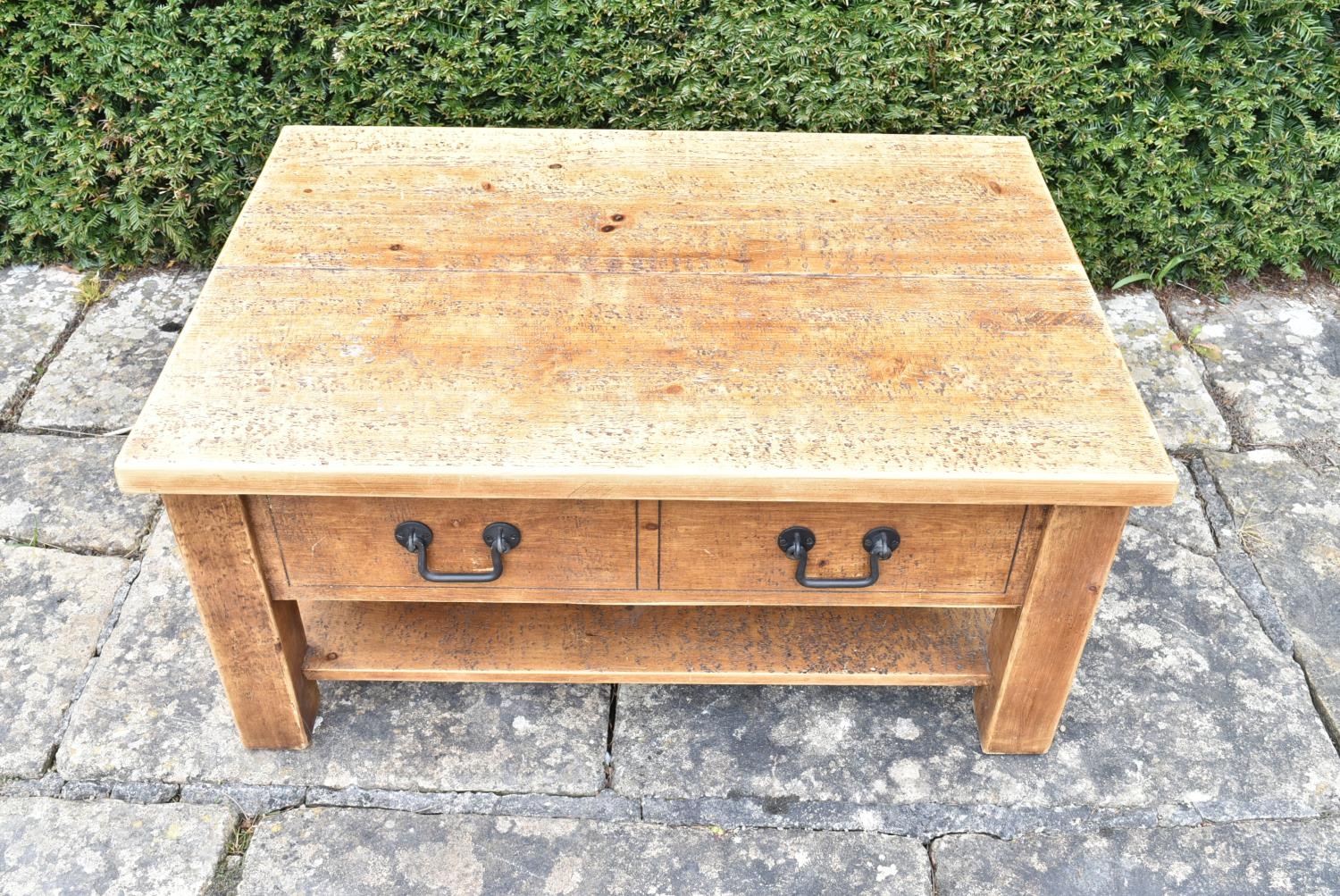 A contemporary pitch pine low table fitted with frieze drawers on block supports united by - Image 2 of 7