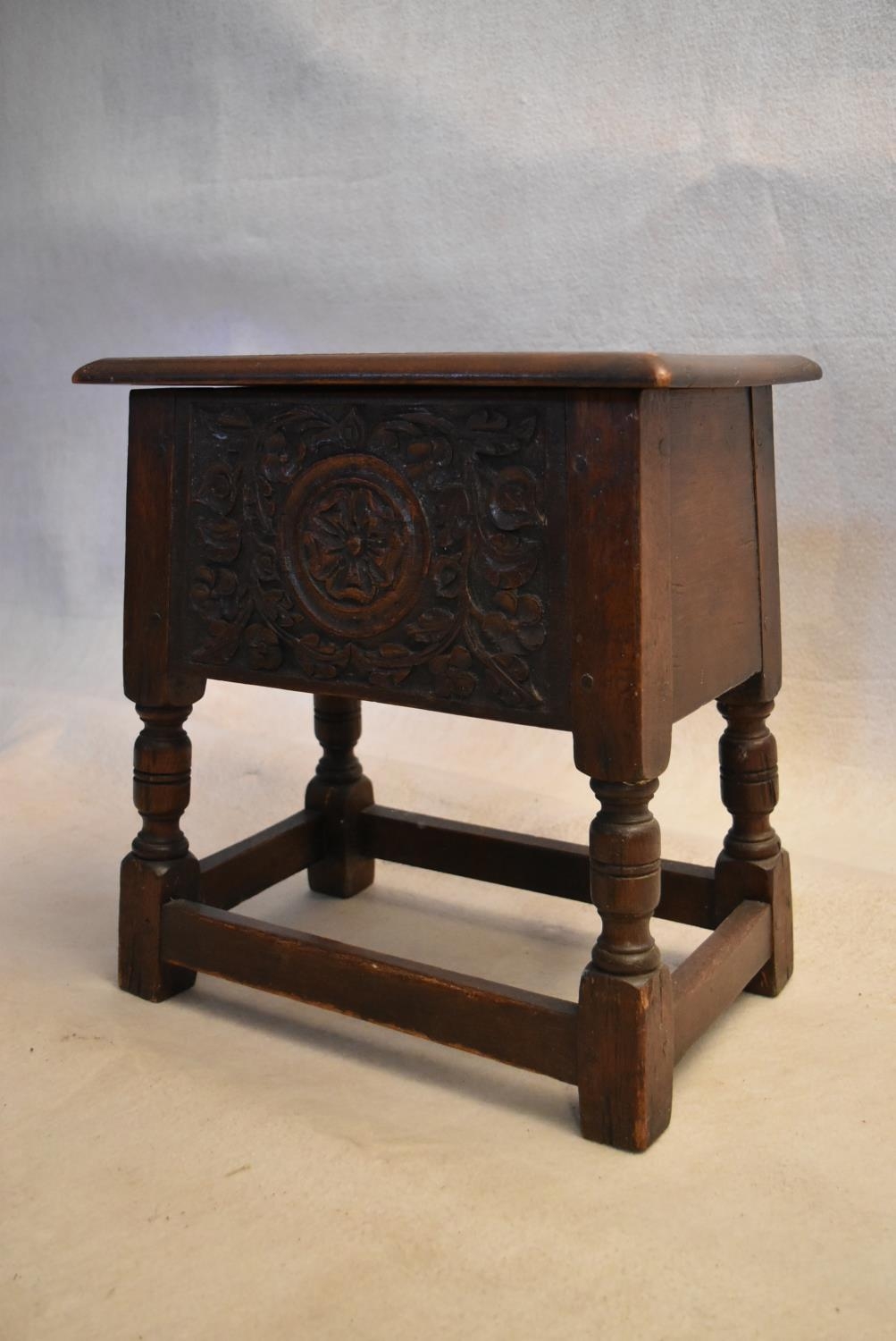 An 18th century country oak bible box stool with carved panel on turned tapering supports. H.47 W.44 - Image 3 of 7