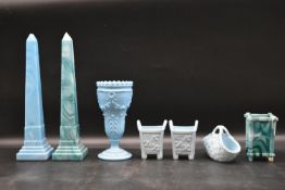 A pair of Victorian blue slag glass obelisks, a similar vase along with a pair of dressing table