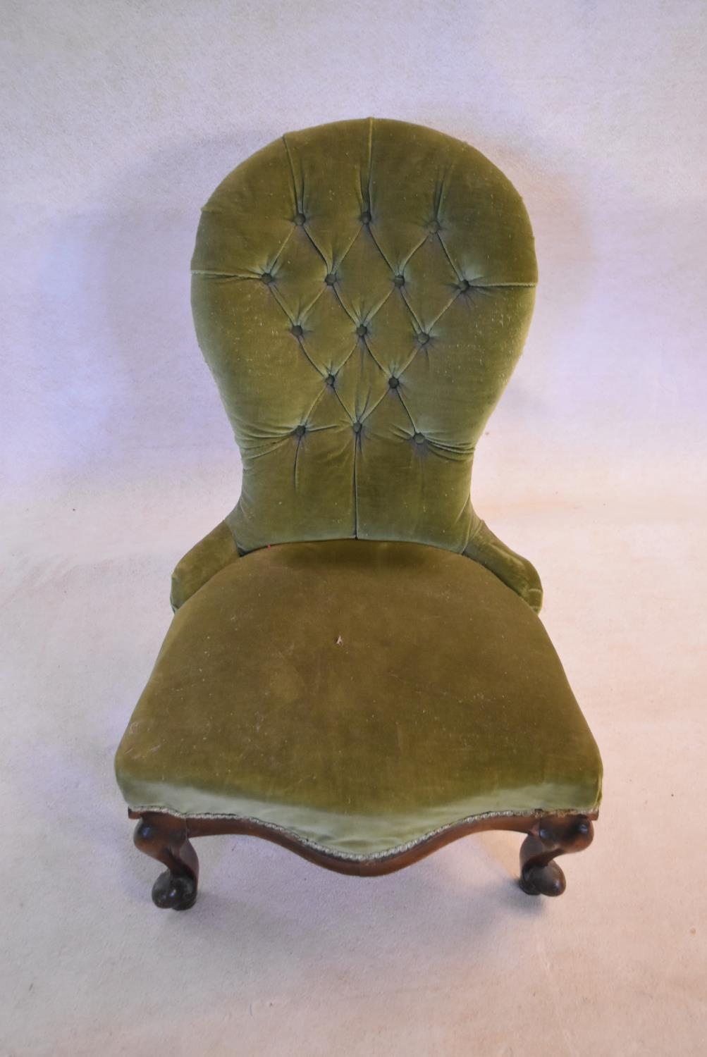 A Victorian mahogany nursing chair in deep buttoned upholstery on carved cabriole supports. H.88 W. - Image 2 of 4