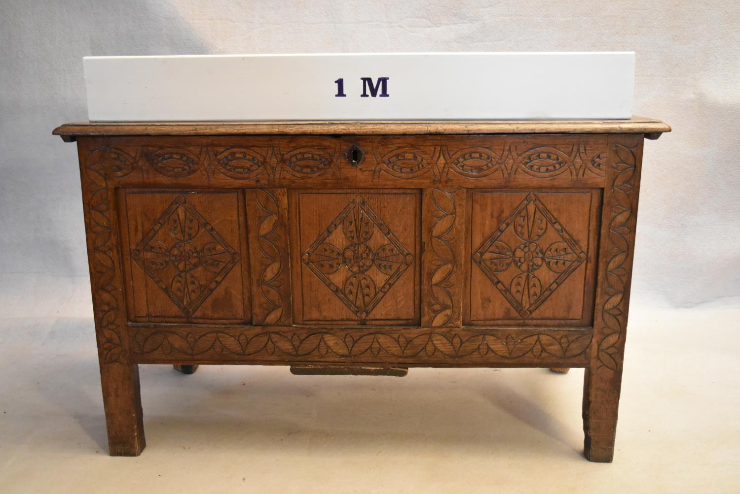 An 18th century country oak coffer with its original hinges and lozenge carved panels raised on - Image 8 of 10