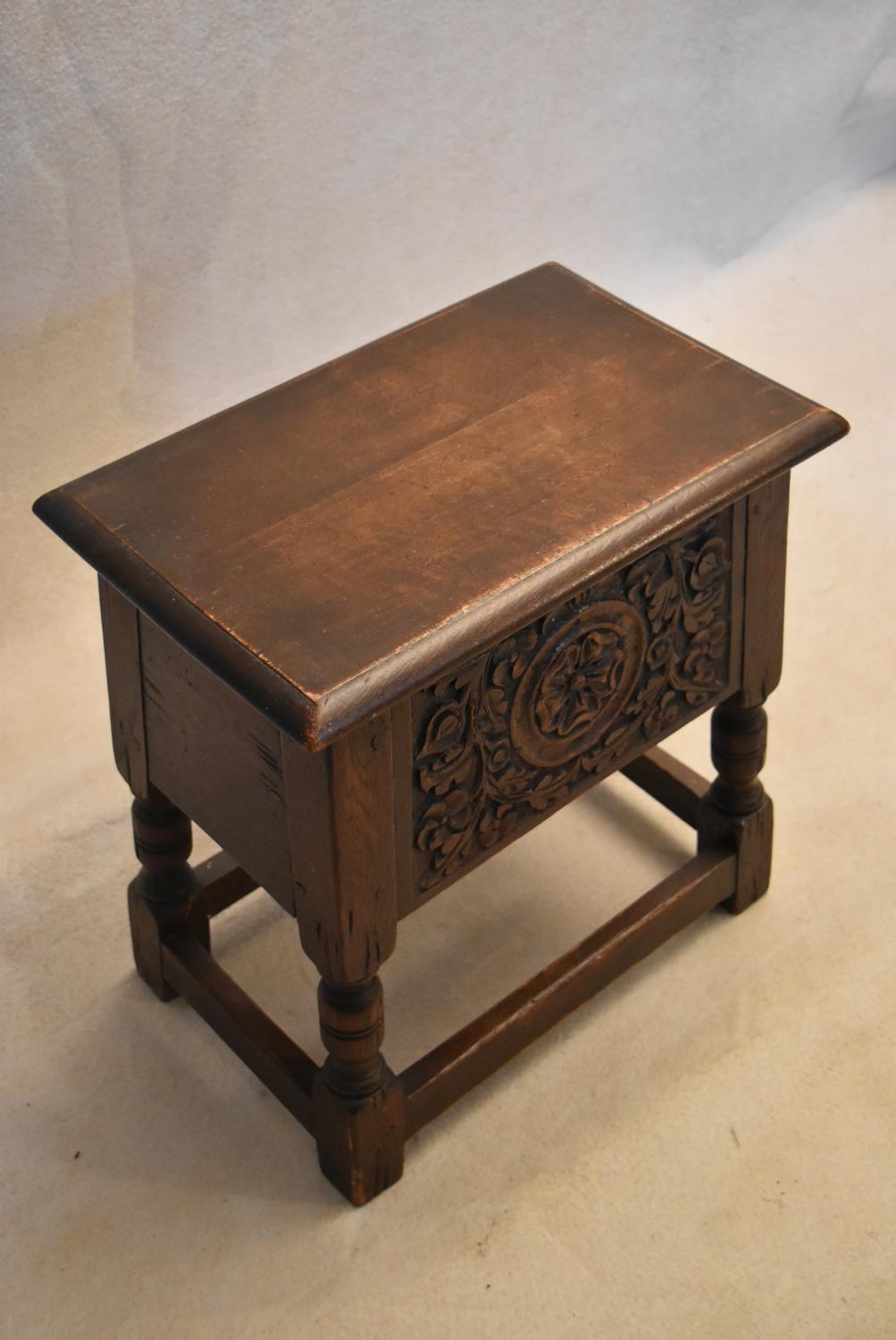 An 18th century country oak bible box stool with carved panel on turned tapering supports. H.47 W.44 - Image 4 of 7