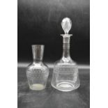 A late Victorian geometrically etched glass decanter with stopper and matching water carafe. H.30
