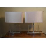 A pair of contemporary Perspex table lamps on chrome base with cream rectangular shades. H. 54 W.