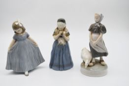 A collection of three Royal Copenhagen female figures. H.25cm