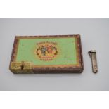 A box of old Havanan cigars and a silver cigar cutter, bears English hallmarks. H.4cm W.24 D.12cm