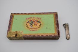 A box of old Havanan cigars and a silver cigar cutter, bears English hallmarks. H.4cm W.24 D.12cm