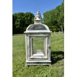 A distressed painted metal framed storm lantern, domed top and turned finial. H.60 W.24 D.24cm