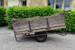 A vintage pine and metal framed garden trolley with drop side. H.85 W.203 D.84cm