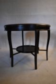 A contemporary 19th century style teak occasional table raised on six slender cabriole supports