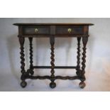 A late 17th century elm and oak side table with frieze drawers on barleytwist stretchered supports