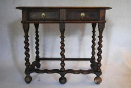 A late 17th century elm and oak side table with frieze drawers on barleytwist stretchered supports