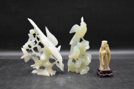 A Chinese carved soapstone standing figure along with two jade figure groups of birds. H.17cm
