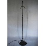 A contemporary twin branch bronze effect standard lamp with naturalistic finish. H.130cm
