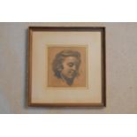 A framed and glazed charcoal study, child portrait, indistinctly signed. H.36 W.35cm