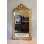 A 19th century overmantel or pier mirror in foliate gilt gesso frame. H.153 W.92cm