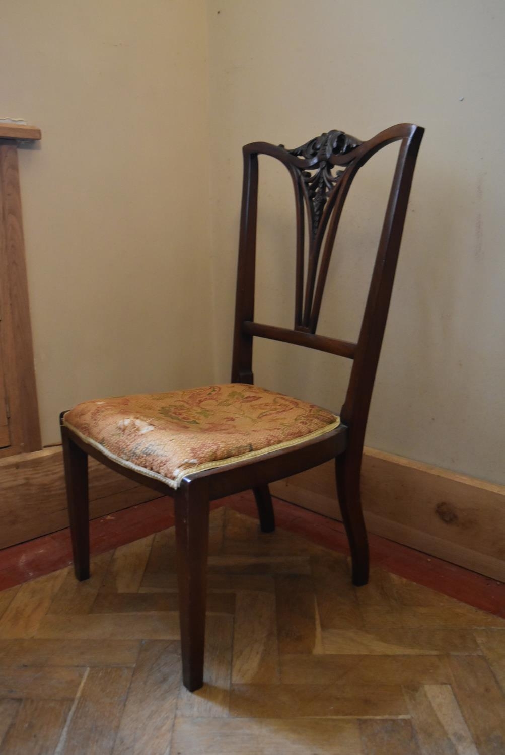 A late Victorian mahogany salon chair with floral carved splat back on square tapering supports. H. - Image 3 of 5