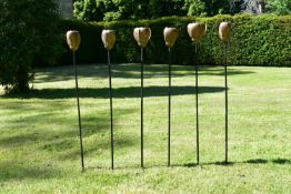 A set of six stainless steel plant stake garden sculptures with rustic rose heads. H.90cm 80-120