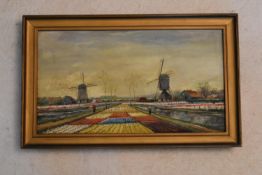 A gilt framed oil on canvas, Windmills and Dutch Bulb Fields landscape, signed A. Martens. H.31 W.