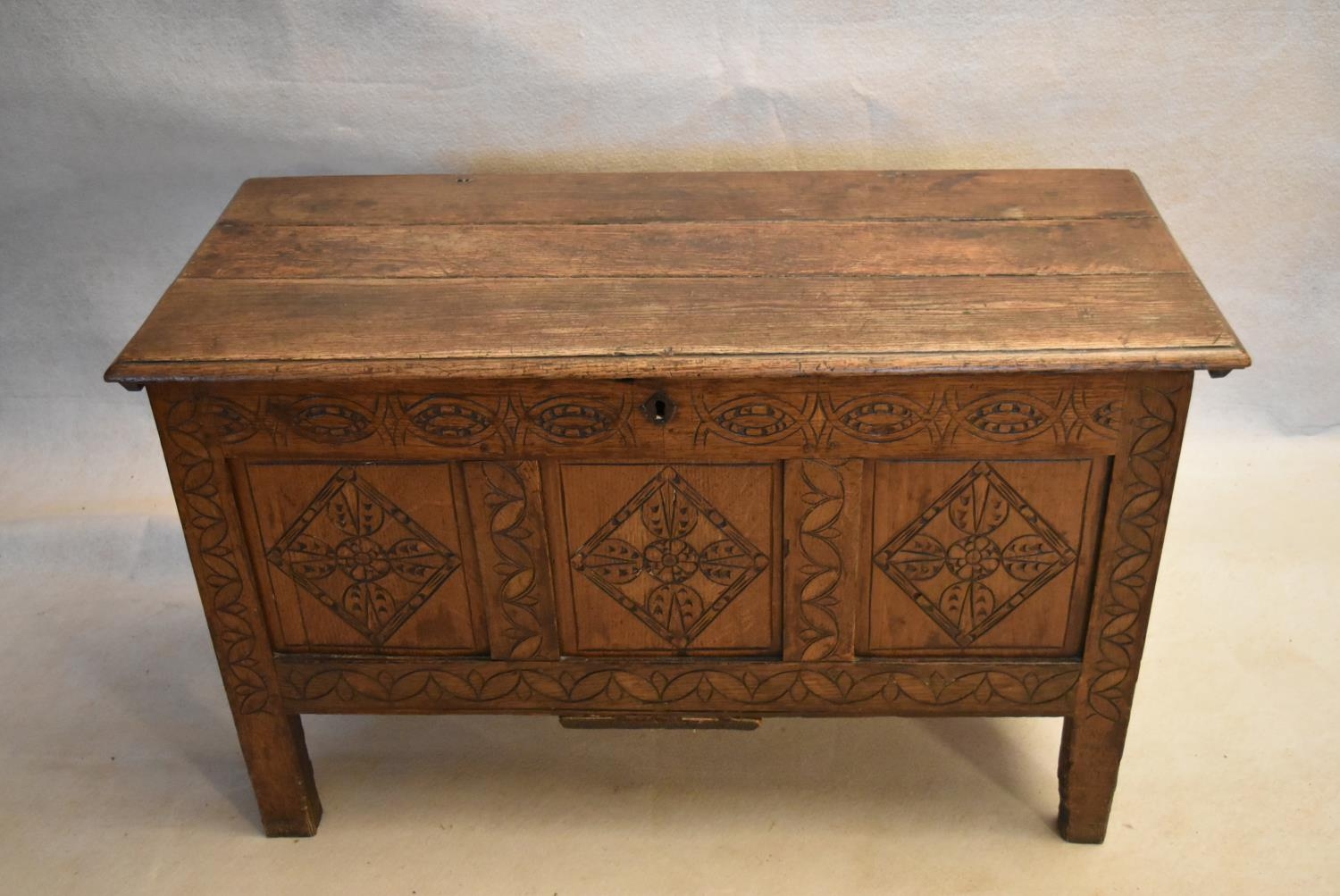 An 18th century country oak coffer with its original hinges and lozenge carved panels raised on - Image 2 of 10