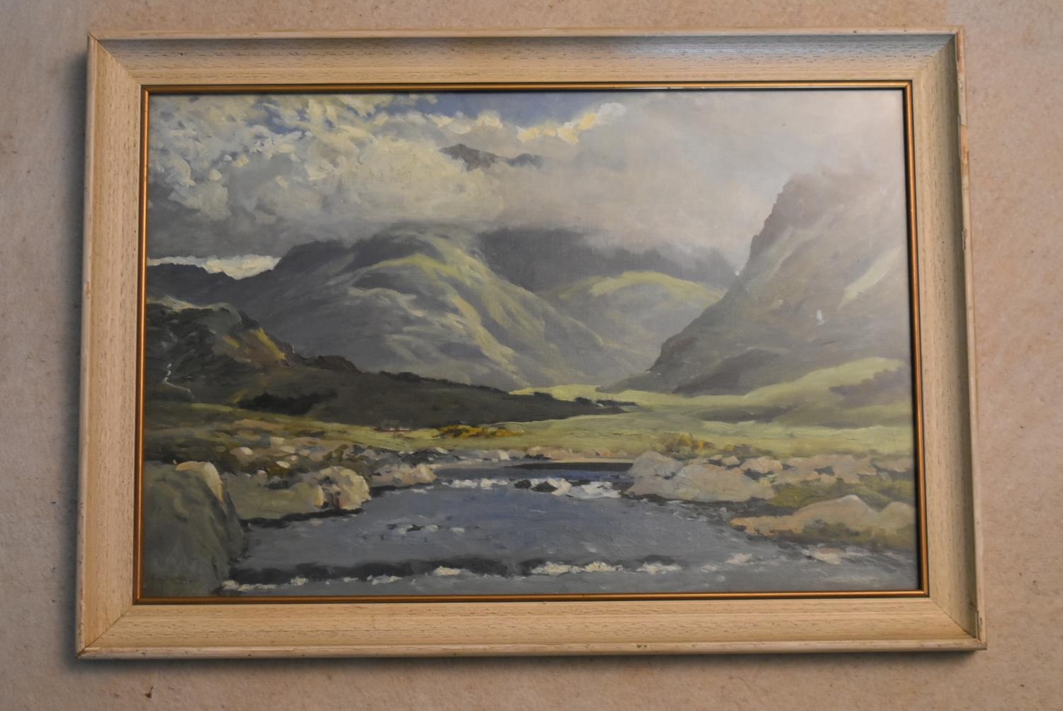 A framed oil on board, In the Maumturk Mountains, Connemara, signed J Scott Harrison, label to the