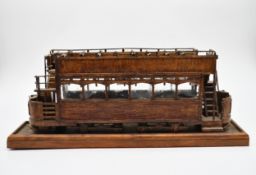 A 19th century style open topped tram made from matchsticks. H.24 W.60 D.15cm