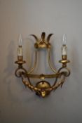A 20th century gilt metal twin branch wall sconce with laurel leaf decoration. H.40 W.31cm