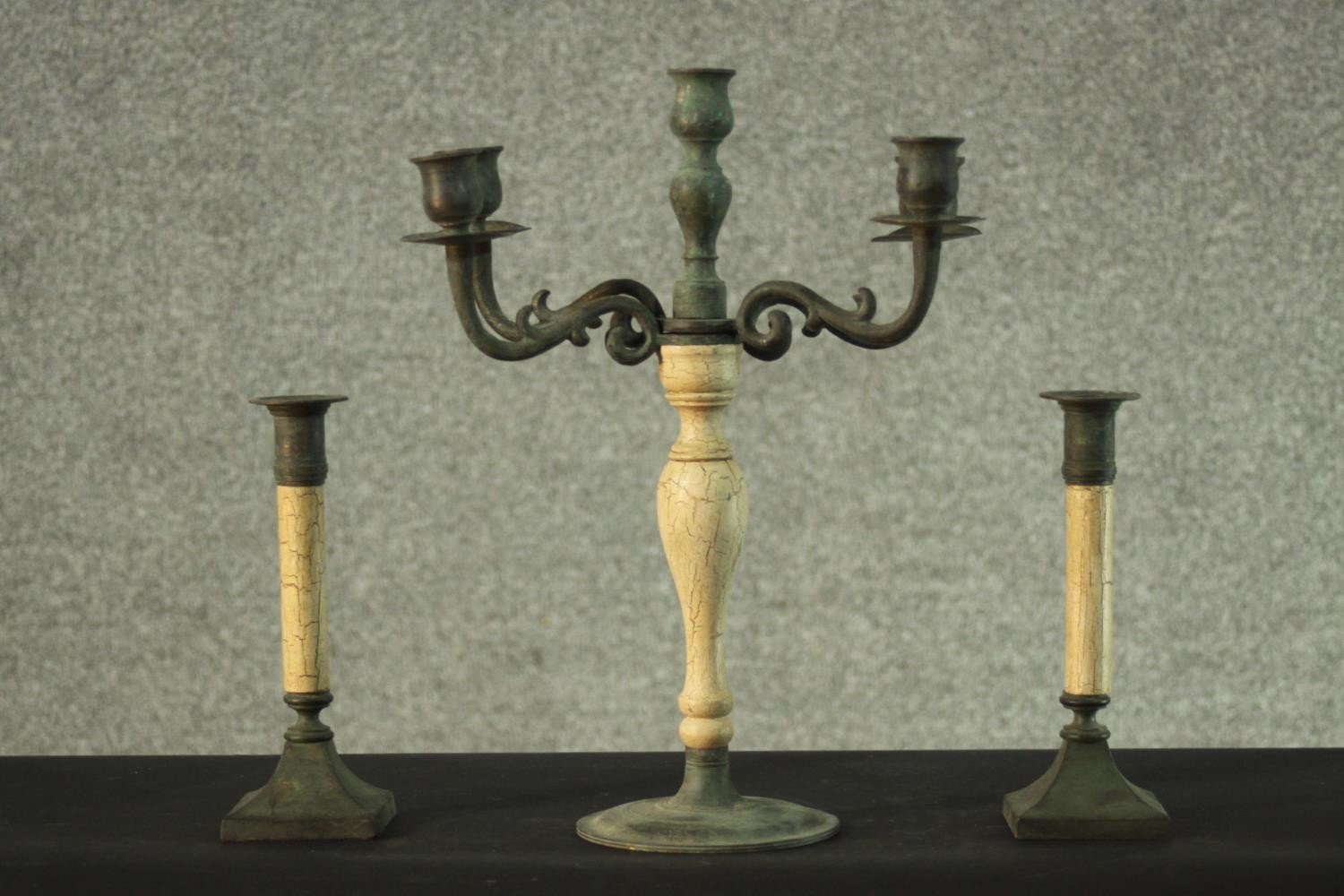 A 19th century style bronzed and faux marble candelabra and a pair of matching candlesticks. H.36