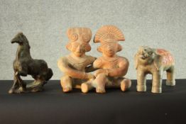 A terracotta figure of a couple, along with a ceramic elephant and a ceramic horse. H.30 W.30 D.6
